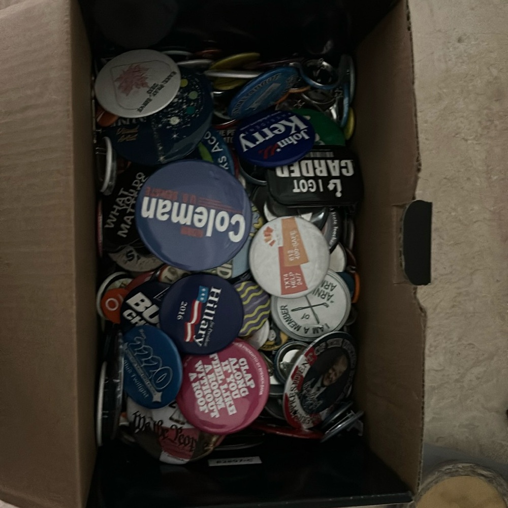 Big box of assorted pins. Politicsl, regional, quirky, etc.
